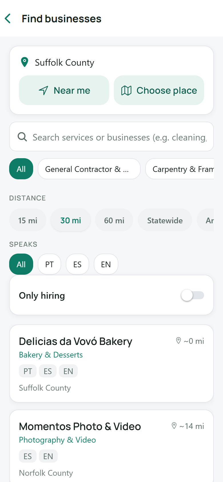 Ganavo business directory screen searching local businesses by service, distance, and language — English, Portuguese, Spanish
