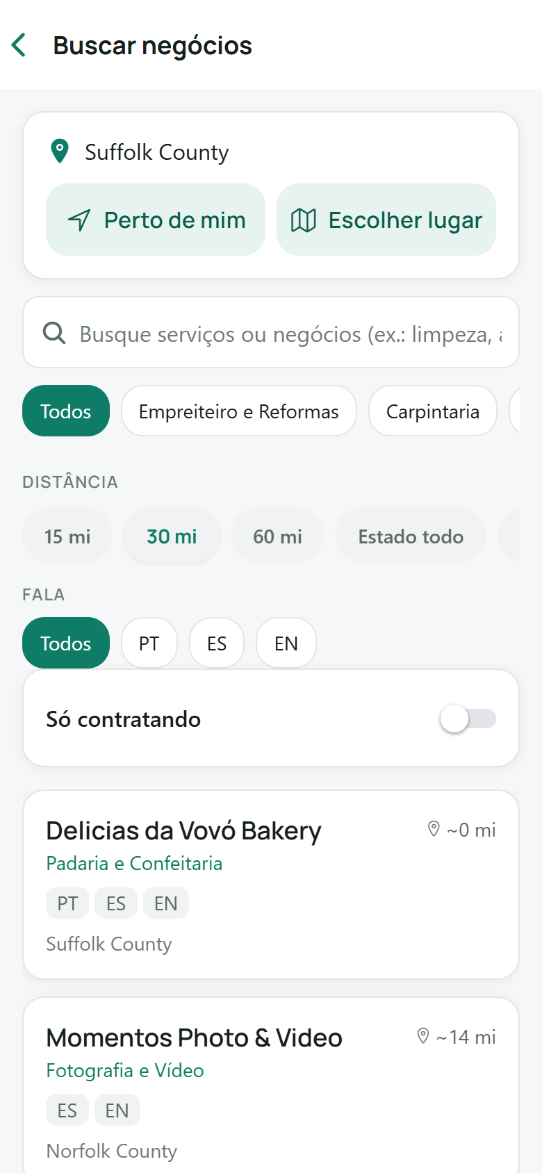 Tela do diretório de negócios do Ganavo: busca de negócios locais por serviço, distância e idioma — português, espanhol, inglês